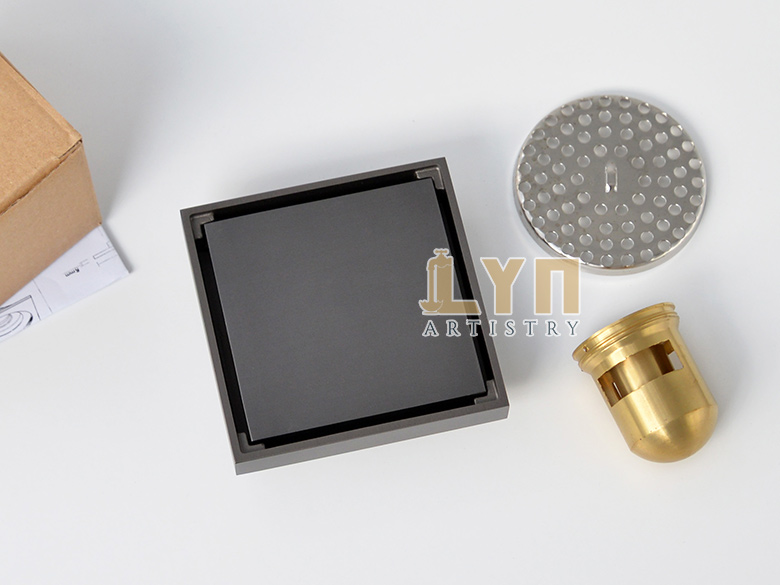 Mở hộp có các linh kiện kèm theo phễu thu sàn lát gạch màu xám BDFG10